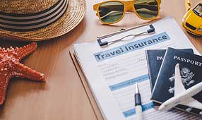 NEA member reviewing travel insurance documents for added security before their trip