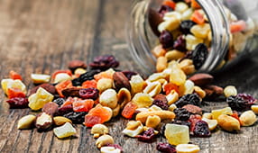 Nuts coming out of jar onto table