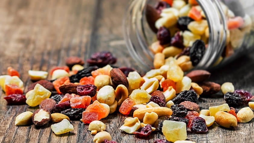 Nuts coming out of jar onto table