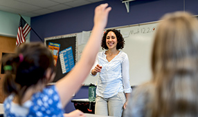 Teacher standing in front of her class
