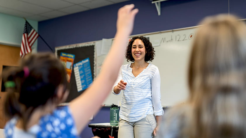 Teacher standing in front of her class