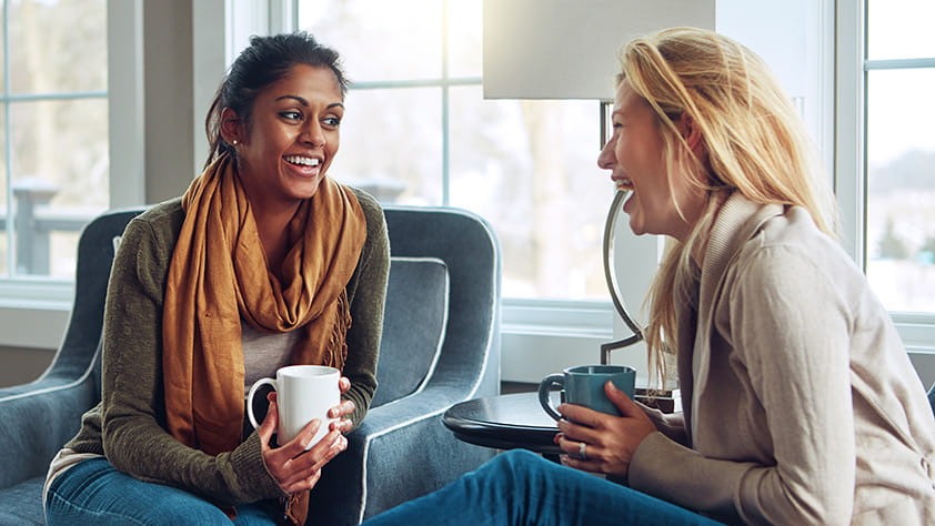 Two women having coffee together