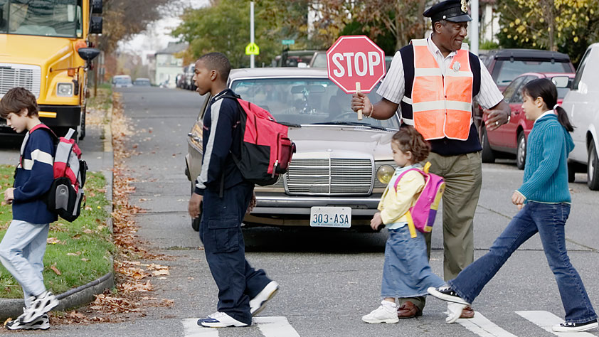 4 Ways to Navigate Back-to-School Safely - Crossing Guard Helping Children Cross the Street
