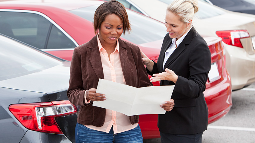 Woman Reviewing Auto Purchase Contract