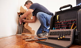 Handyman Repairing Wall