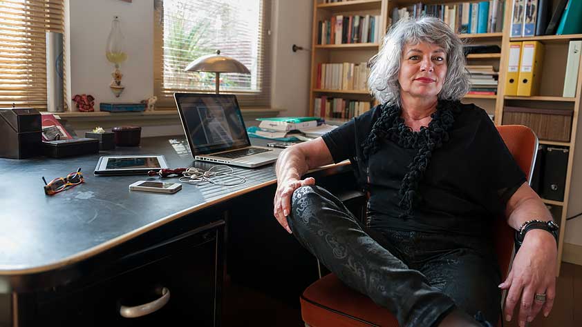 Home Improvement Projects That Will Make Teachers Swoon - Confident Older Woman Sitting at Her Home Office Desk