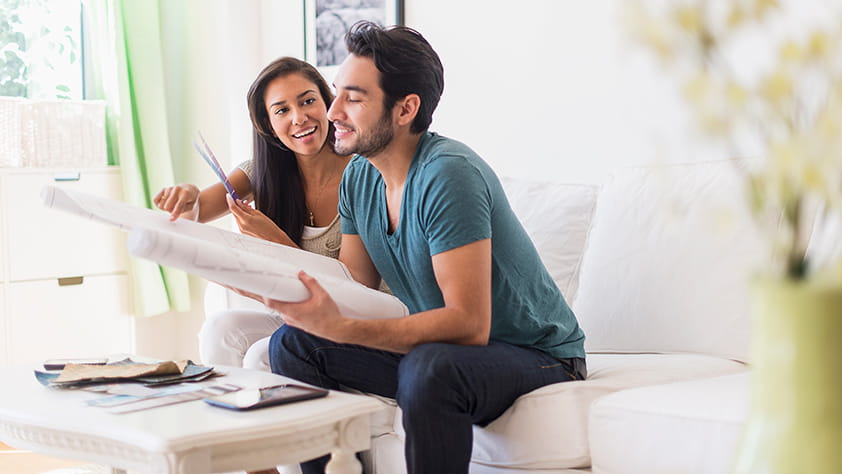 Couple Reviewing Architectural Drawings