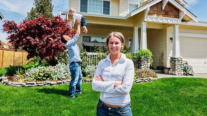 Family Playing on Front Lawn