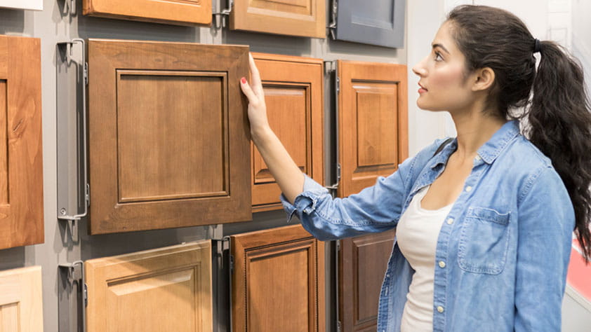 Woman Looking at Custom Cabinetry Options