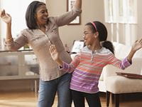 Mother and daughter dancing