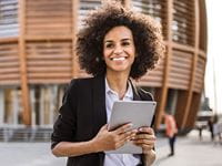 Student Loan Debt Navigator- Woman Holding Tablet