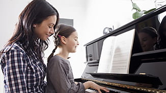 NEA Level Premium Life Insurance - Mother and Daughter Playing Piano