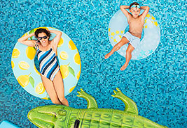Mother and Son Relaxing on Inflatable Pool Floats - NEA Travel: Hotels