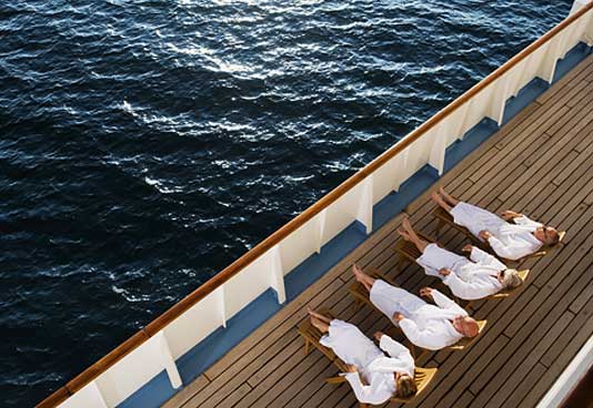 Friends Relaxing on a Cruise - NEA Travel: Cruises