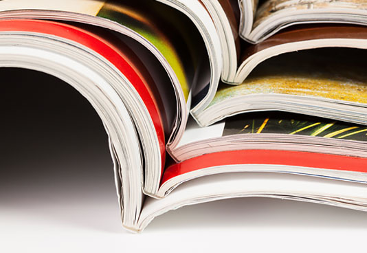 Closeup of a Stack of Magazines - NEA Magazine Service
