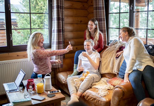 Group of Friends in a Resort Cabin - NEA Travel: Resorts