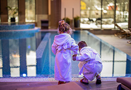 Two Young Children at a Hotel Indoor Pool