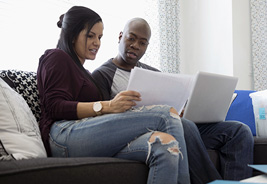 NEA Personal Loan - Couple Reviewing Paperwork