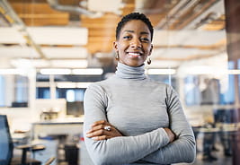 DirectInvest Retirement Program - Confident Young Woman with Crossed Arms