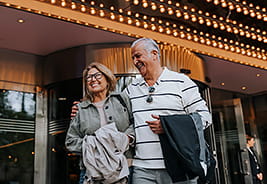 Older Couple Standing Outside a Theater - NEA Discount Tickets Program