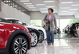 Woman Buying a Car in a Showroom