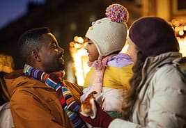 Happy Family at an Outdoor Holiday Market