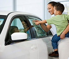 NEA Auto Buying Program - Woman and son shopping for a car