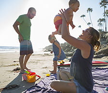 Happy Young Family at the Beach - NEA Complimentary Life Insurance