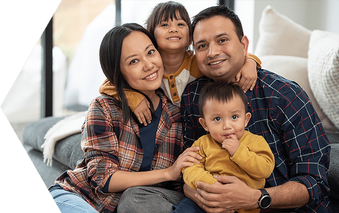 Happy Family Sitting on a Sofa