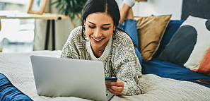Woman Shopping on Laptop - NEA Discount Marketplace