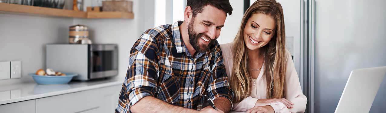 NEA Advantage Loan - Couple Looking at Laptop