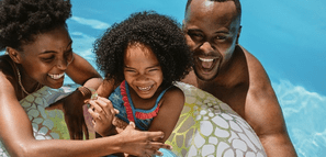 Happy Family in Swimming Pool