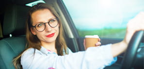Woman Smiling as She Drives - NEA Auto & Home Insurance Program