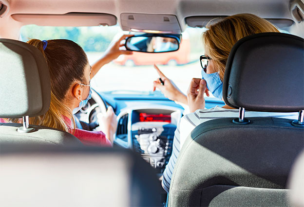 NEA Auto Buying Program- Mom teaching daughter to drive