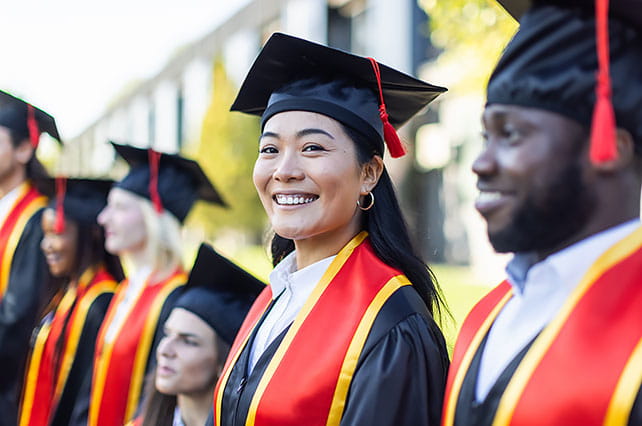 Smiling Student at a College Graduation Ceremony - NEA Education Advancement Program