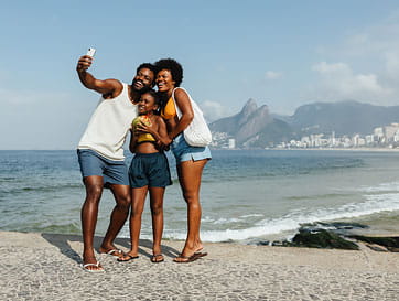 Happy Family Taking a Selfie at the Beach