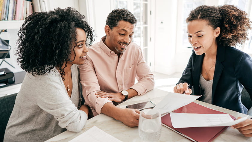 A couple speaking to their lawyer