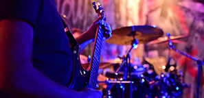 Guitarist and drummer and during a live music concert