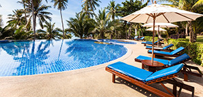 Tropical beach front hotel resort with swimming pool