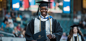 Young man who just received his degree at his college graduation